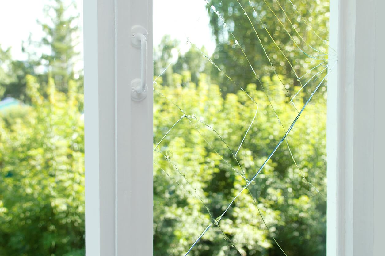 What causes windows to crack in my home?